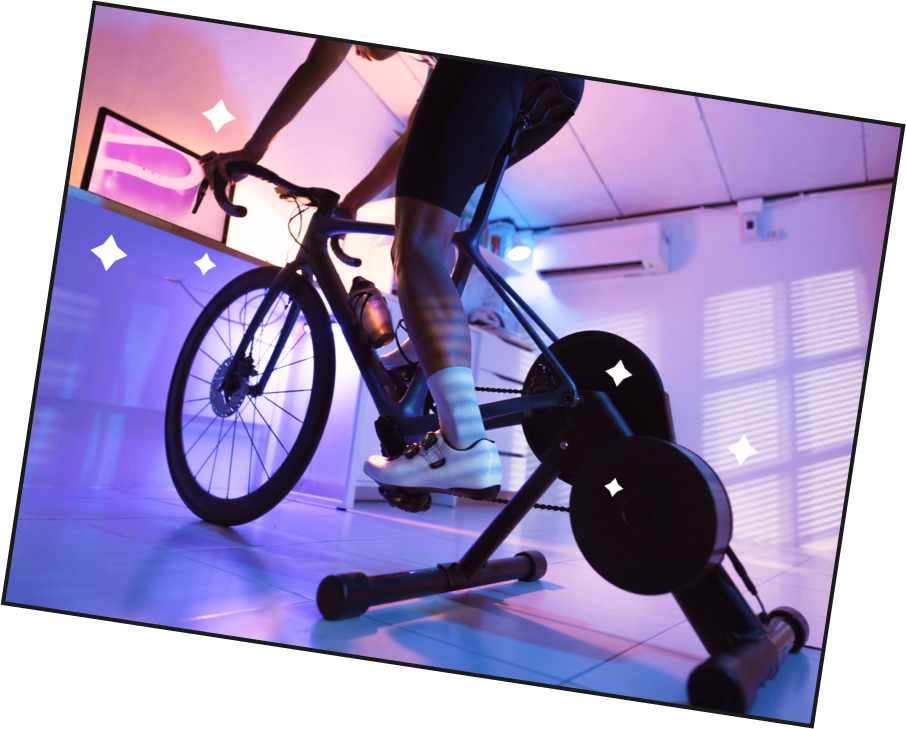 A person riding on a smart trainer using the startona web-app